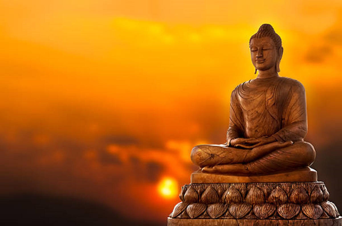 Buddha Statue and sunset background
